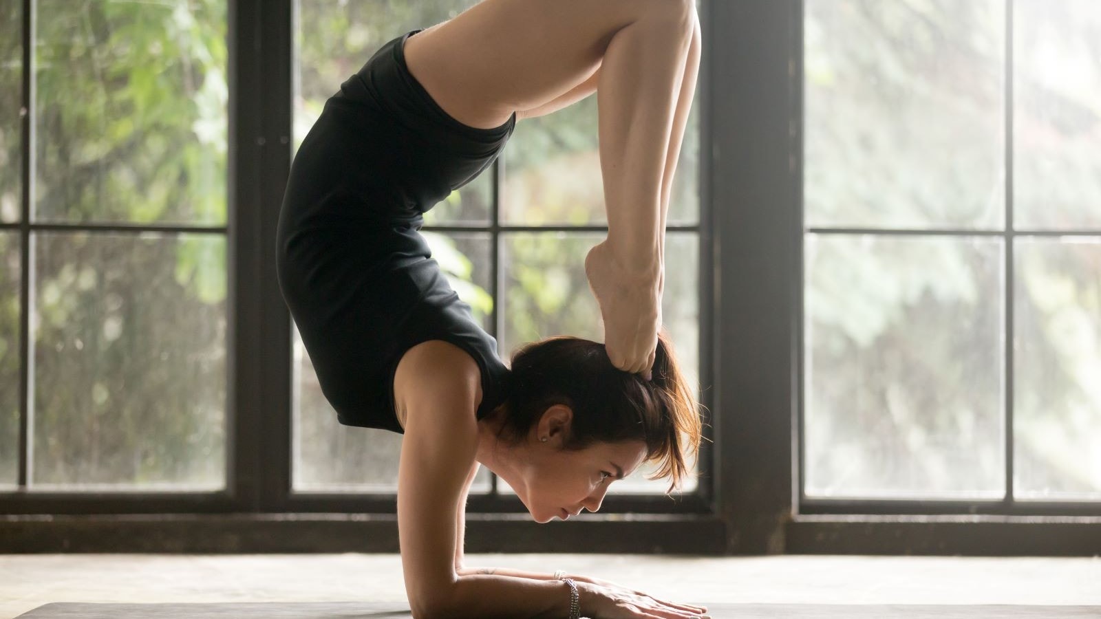 A woman posing as a scorpian